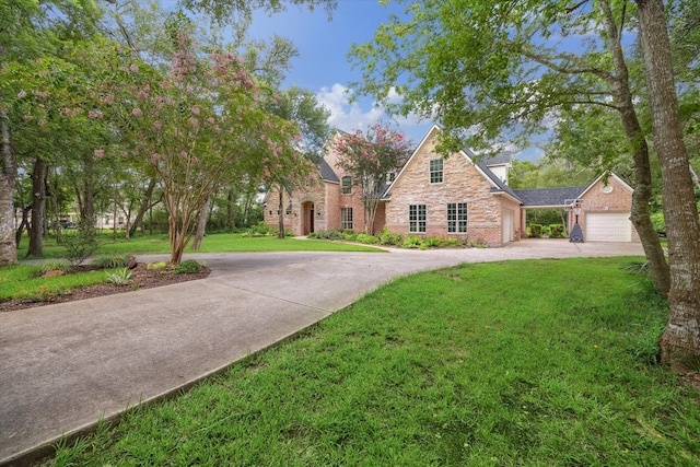 view of front facade featuring a garage and a front lawn