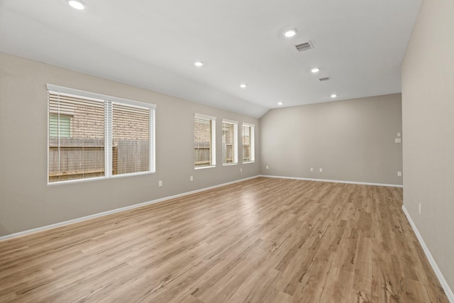 empty room featuring baseboards, light wood finished floors, visible vents, and recessed lighting