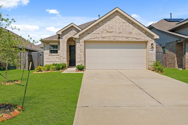 view of front facade with a garage and a front yard