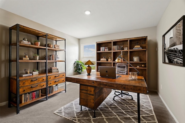 carpeted office with baseboards