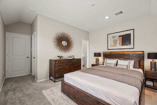 bedroom with visible vents, vaulted ceiling, light carpet, and baseboards