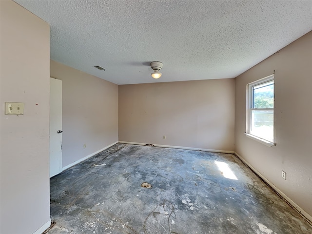 2613 34th Ave N, Texas City, TX 77590 - empty room with a textured ceiling and baseboards