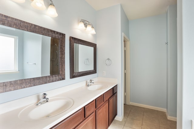 bathroom featuring tile patterned flooring and double sink vanity