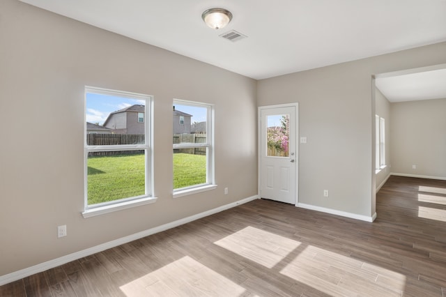 spare room featuring hardwood / wood-style flooring