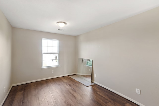 empty room featuring wood-type flooring