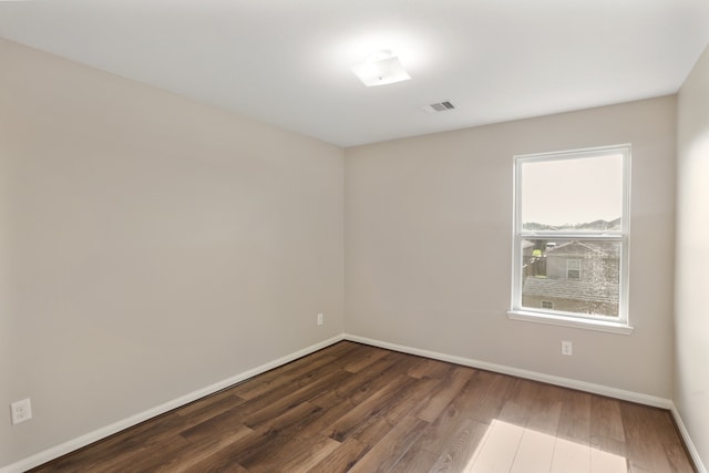 spare room with hardwood / wood-style flooring