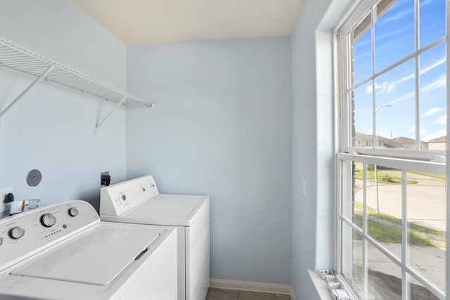 washroom with tile patterned floors and washer and dryer