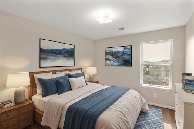 bedroom featuring hardwood / wood-style floors