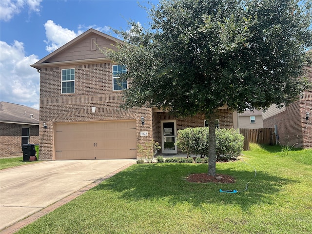 view of front property with a garage and a front lawn