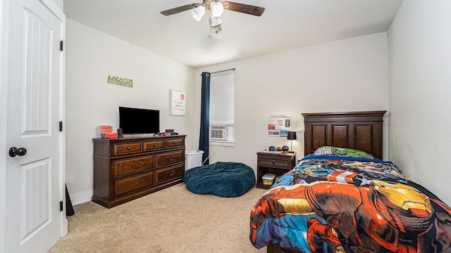 carpeted bedroom with ceiling fan and cooling unit