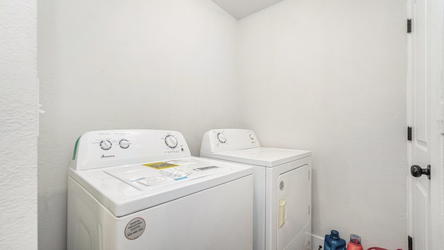 laundry room with washer and dryer