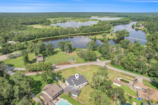 birds eye view of property with a water view