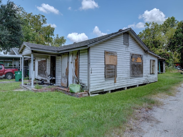 view of property exterior featuring a yard