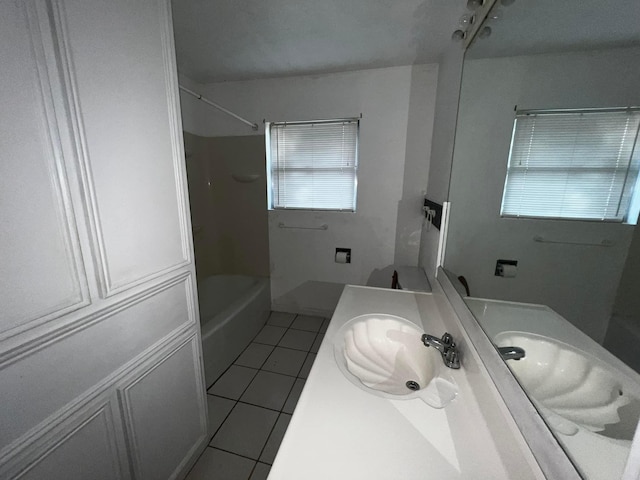 bathroom featuring bathtub / shower combination, vanity, and tile patterned floors