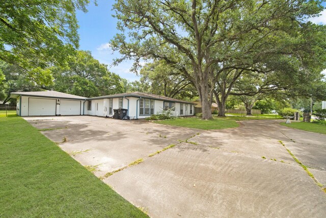 1826 E Ave, Katy, TX 77493 - view of front facade with concrete driveway and an attached garage