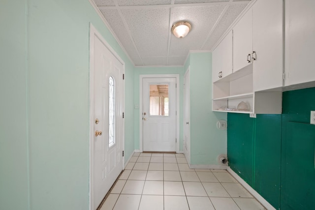 1826 E Ave, Katy, TX 77493 - doorway featuring baseboards, light tile patterned floors, and a drop ceiling