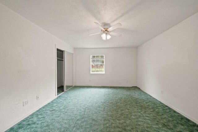 1826 E Ave, Katy, TX 77493 - unfurnished bedroom with a textured ceiling, carpet, a closet, a ceiling fan, and baseboards