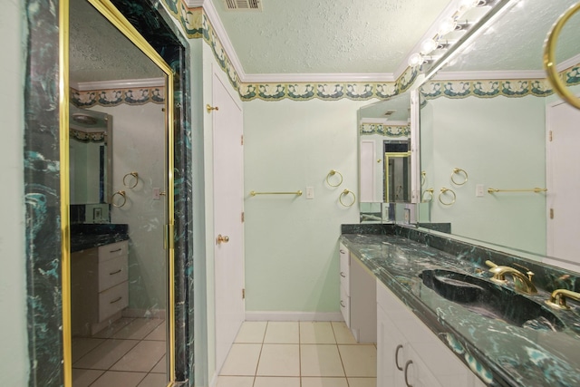1826 E Ave, Katy, TX 77493 - bathroom with ornamental molding, a textured ceiling, tile patterned floors, double vanity, and a stall shower