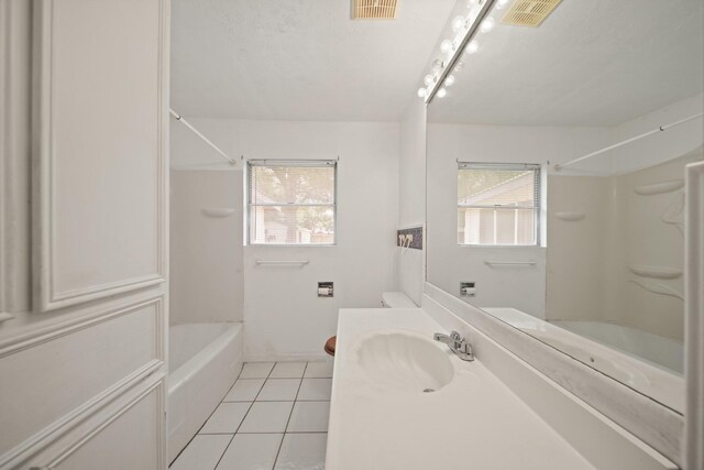 1826 E Ave, Katy, TX 77493 - bathroom featuring tile patterned floors, vanity, shower / bathtub combination, and plenty of natural light