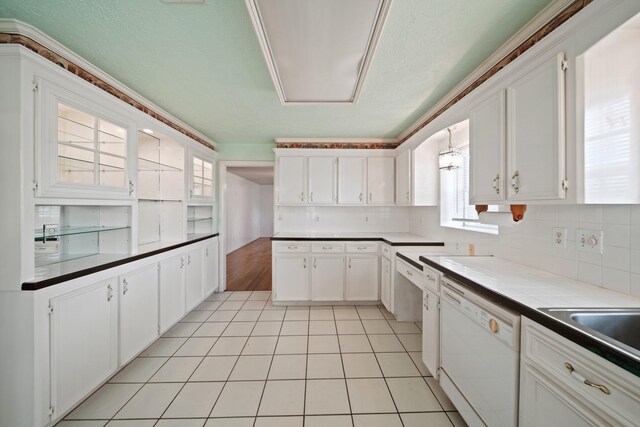 1826 E Ave, Katy, TX 77493 - kitchen featuring dishwasher, white cabinetry, decorative backsplash, and light tile patterned flooring