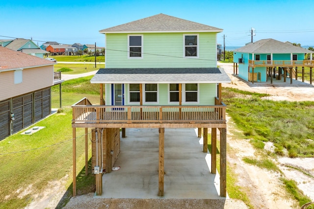 rear view of property featuring a carport