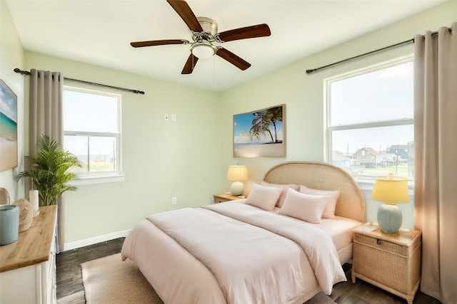 bedroom featuring dark wood-type flooring and ceiling fan