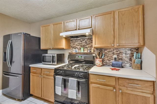 kitchen featuring tasteful backsplash, stainless steel appliances, light brown cabinets, and light tile patterned floors