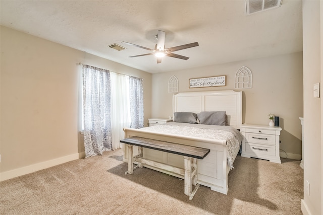 bedroom featuring ceiling fan and light carpet