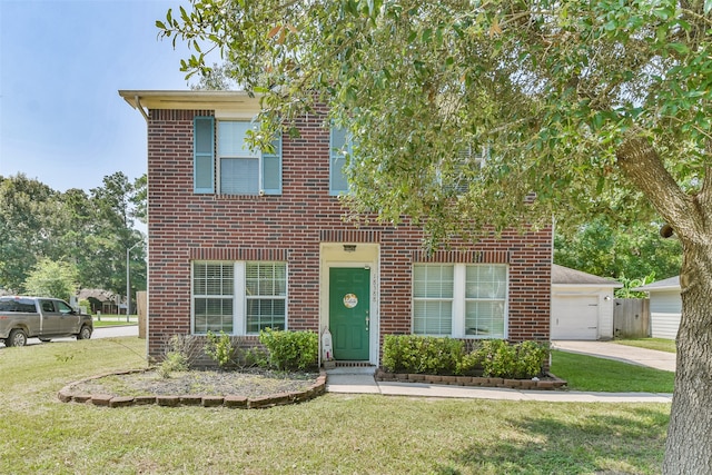 view of front of home with a front yard and a garage