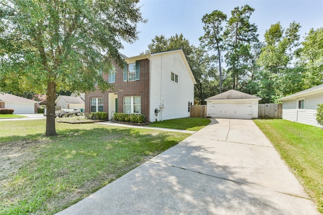 view of front facade featuring a front yard, an outbuilding, and a garage