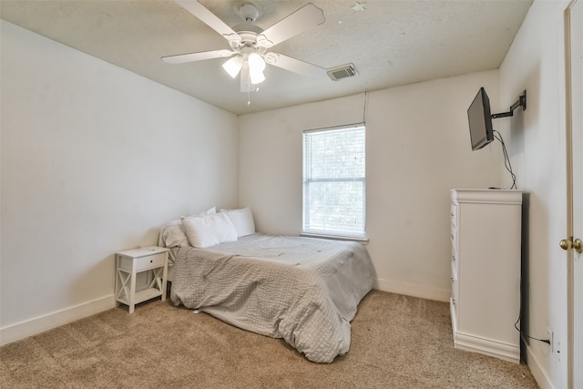 bedroom with ceiling fan and light colored carpet