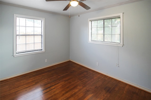 empty room featuring hardwood / wood-style flooring, ornamental molding, and ceiling fan