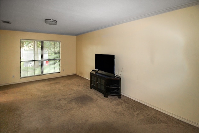 living room with crown molding and carpet