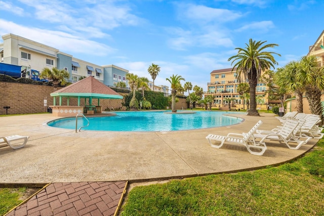 view of swimming pool featuring a gazebo and a patio