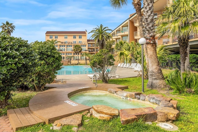 view of pool featuring a community hot tub