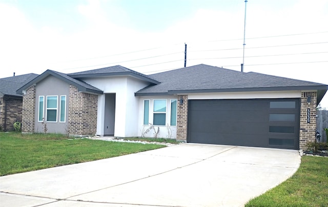 ranch-style house featuring a front yard and a garage