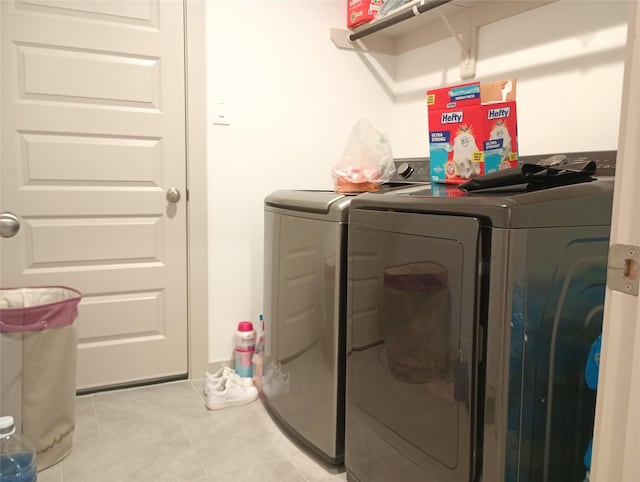 3335 Balboa Grove Ln, Missouri City, TX 77459 - laundry room with light tile patterned floors, washer and clothes dryer, and laundry area