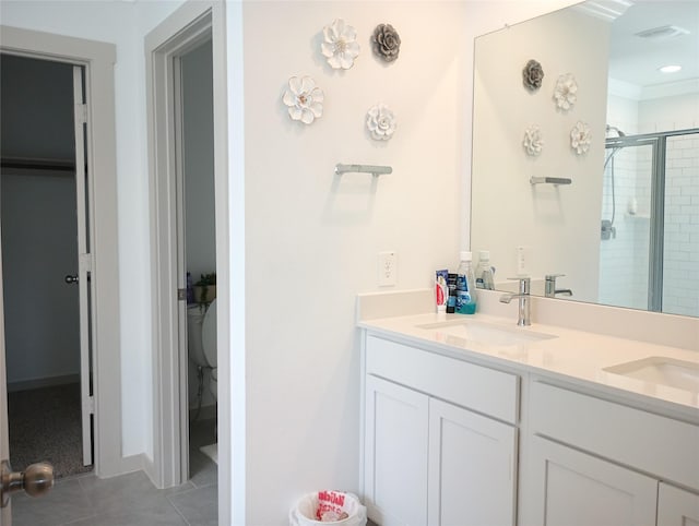 3335 Balboa Grove Ln, Missouri City, TX 77459 - bathroom featuring a shower stall, tile patterned floors, double vanity, and a sink