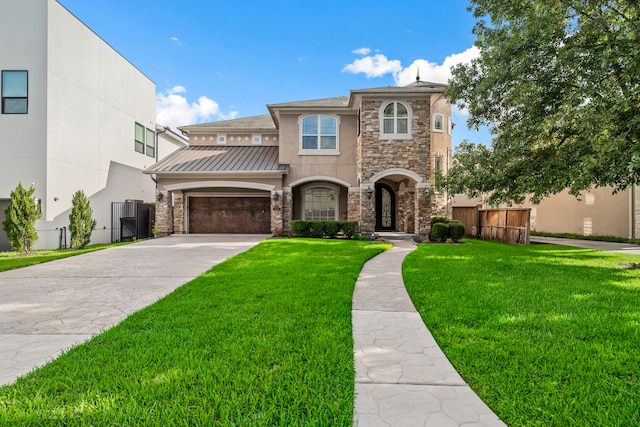 view of front of house with a garage and a front lawn