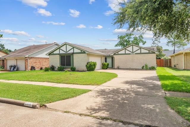 view of front of property with a garage and a front lawn