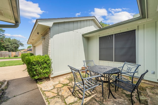 view of patio / terrace featuring a garage