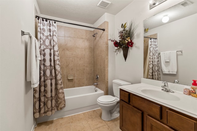 full bathroom with toilet, vanity, tile patterned flooring, shower / bath combination with curtain, and a textured ceiling