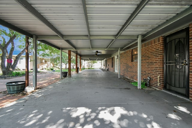 view of patio with a carport and ceiling fan