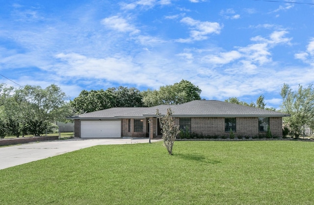 ranch-style home with a garage and a front lawn