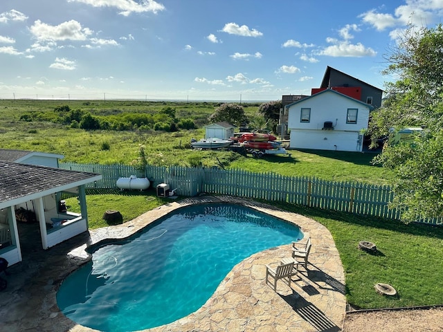 view of pool featuring a yard, a fenced backyard, a fenced in pool, and a patio