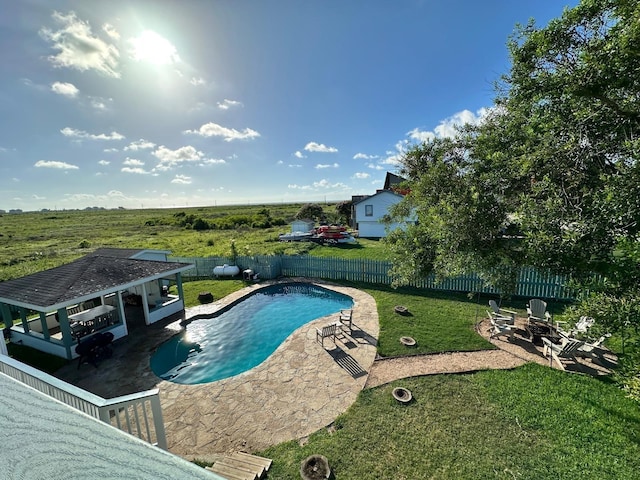 view of swimming pool with a storage structure, an outdoor structure, a fenced backyard, and a fenced in pool