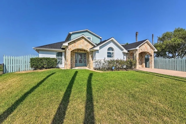 ranch-style home with a front lawn