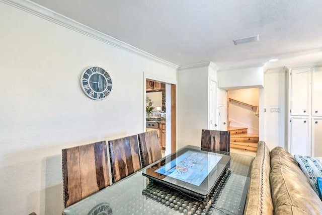 living area featuring ornamental molding