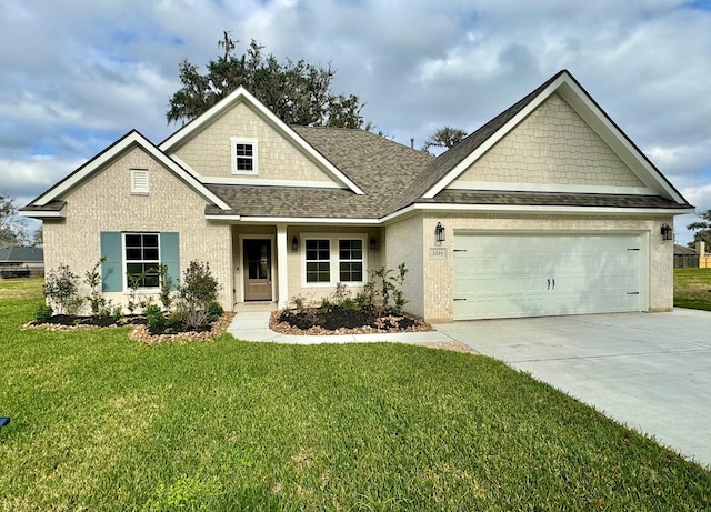 craftsman inspired home with a garage and a front lawn