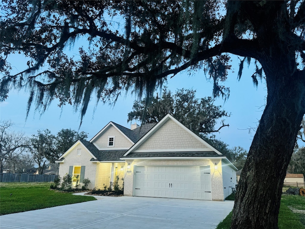 2233 Ridgewood Dr, West Columbia, TX 77486 - view of front of house with a garage and a front yard